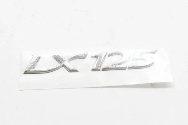 Promozione Esclusiva 656223 - TARGHETTA ORIGINALE 'LX125' PER VESPA LX 125 2005>2009